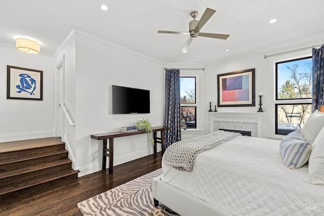 bedroom featuring recessed lighting, crown molding, baseboards, and wood finished floors