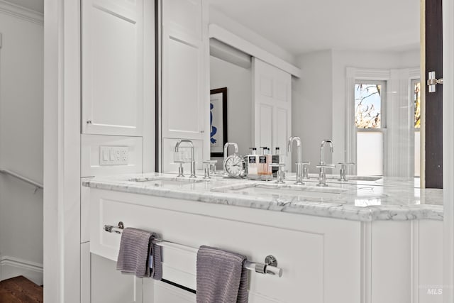 full bath with double vanity and a sink