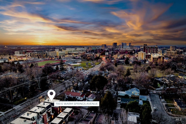 aerial view at dusk featuring a view of city