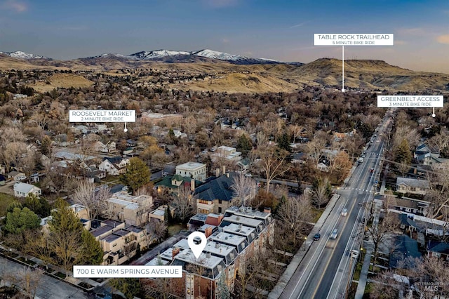 birds eye view of property with a mountain view