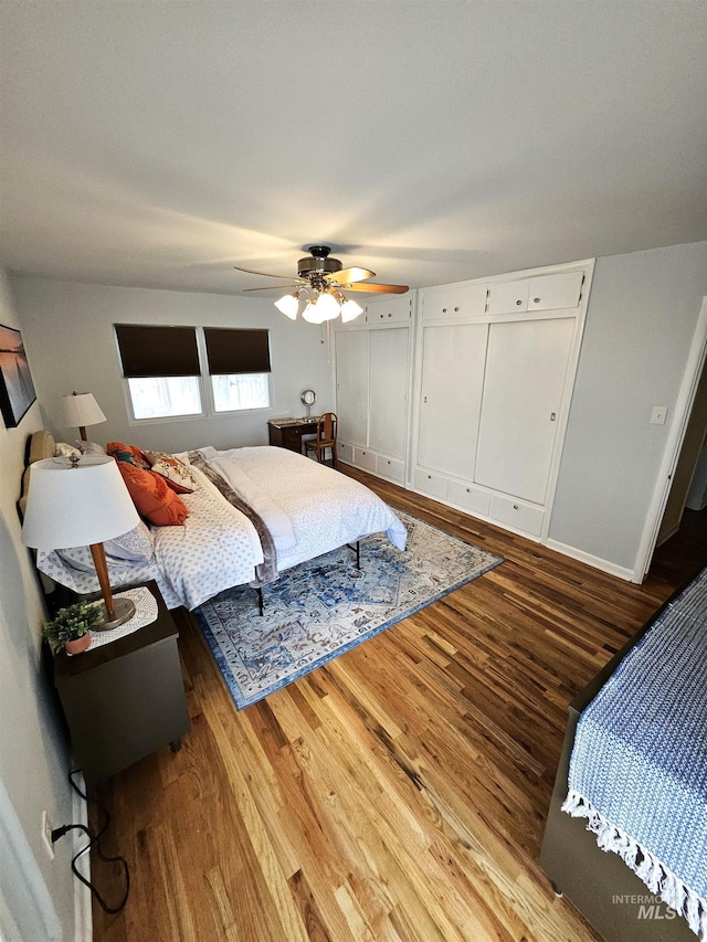 bedroom featuring hardwood / wood-style flooring and ceiling fan