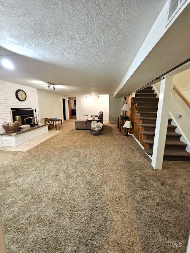 unfurnished living room with a textured ceiling and carpet