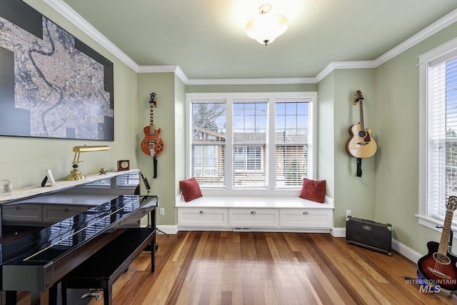 interior space with dark wood-style floors, baseboards, and crown molding