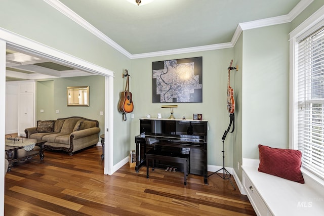 living area featuring crown molding, baseboards, and wood finished floors