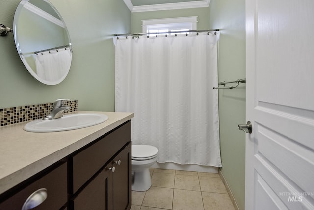 bathroom with tasteful backsplash, toilet, tile patterned floors, crown molding, and vanity