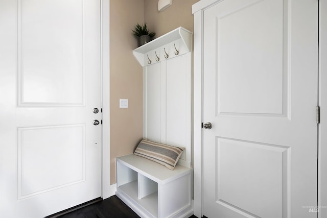 mudroom with dark wood finished floors