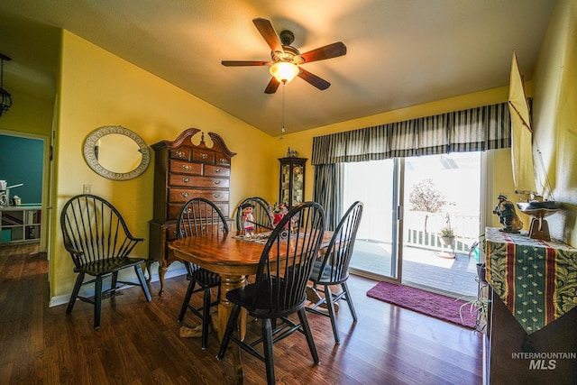 dining room featuring lofted ceiling, baseboards, a ceiling fan, and wood finished floors