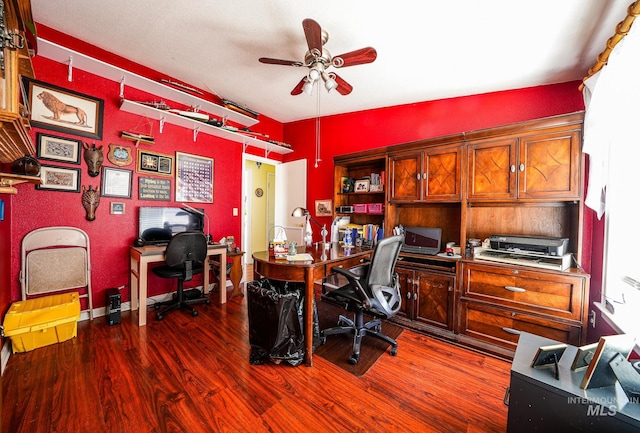 office space featuring ceiling fan, dark wood-style flooring, and lofted ceiling