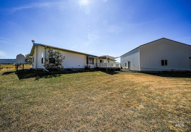 exterior space with an outbuilding, a yard, and an outdoor structure