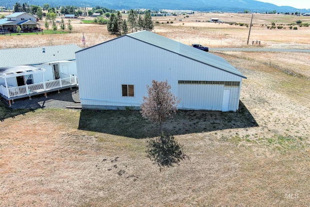 exterior space with a garage and a mountain view