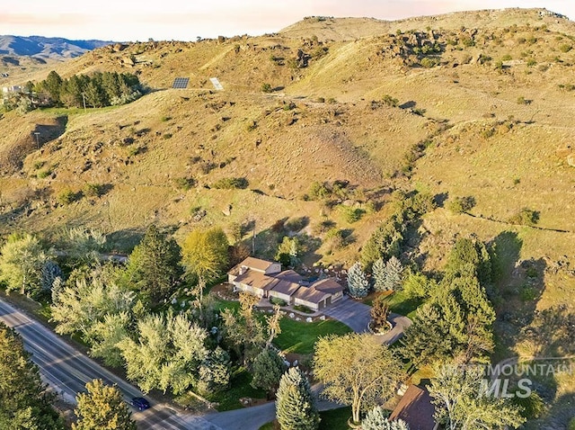 drone / aerial view featuring a mountain view
