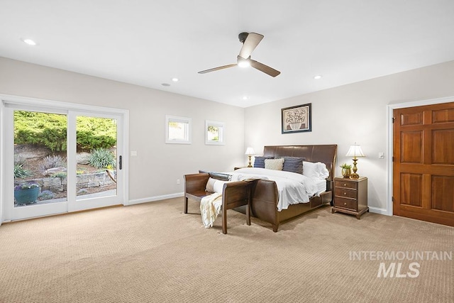 bedroom featuring access to outside, baseboards, multiple windows, and light carpet