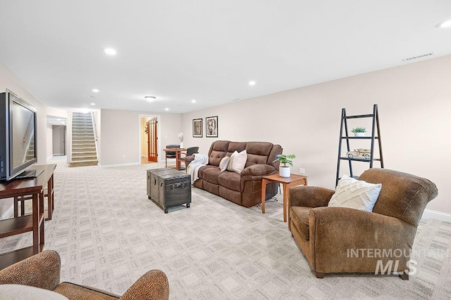 living area with stairway, recessed lighting, and visible vents