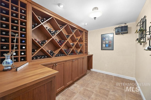 wine room featuring baseboards