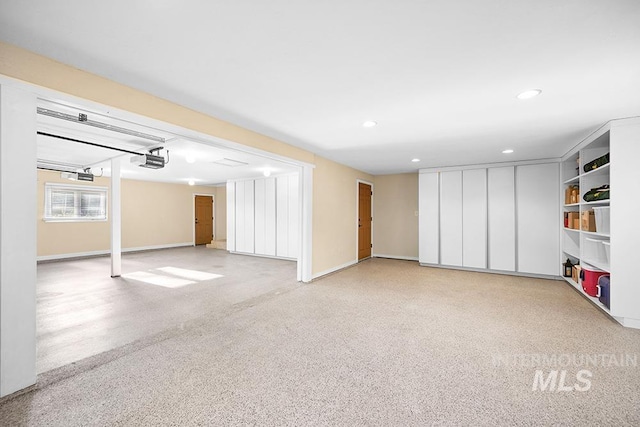basement featuring baseboards and recessed lighting
