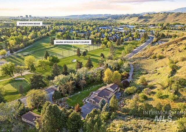 birds eye view of property featuring a mountain view