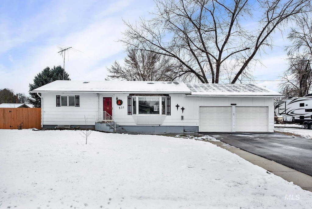 single story home featuring a garage