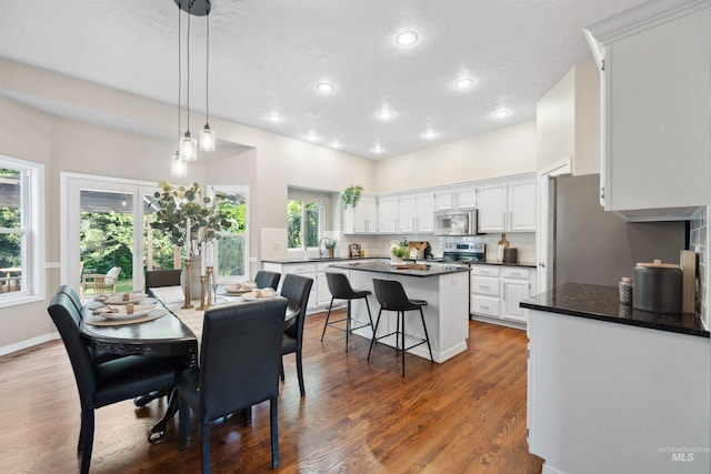 3376 E Echo Ct, Boise, ID 83712 - dining area with recessed lighting, wood finished floors, and a textured ceiling