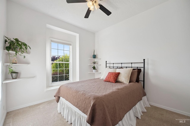 3376 E Echo Ct, Boise, ID 83712 - bedroom with carpet, baseboards, and a ceiling fan
