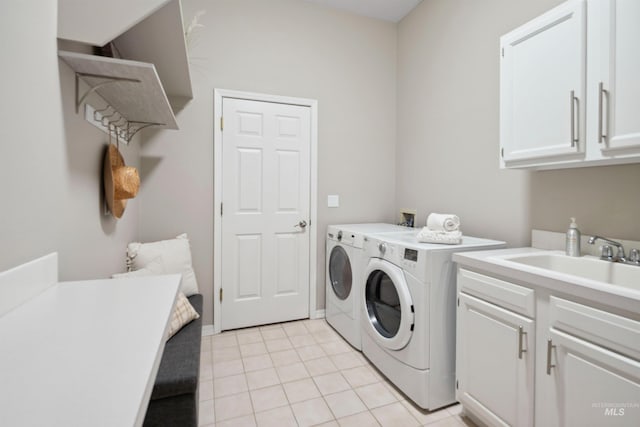 3376 E Echo Ct, Boise, ID 83712 - washroom featuring cabinet space, washer and dryer, and light tile patterned floors