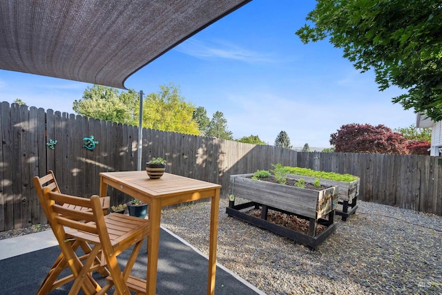 3376 E Echo Ct, Boise, ID 83712 - fenced backyard with a vegetable garden