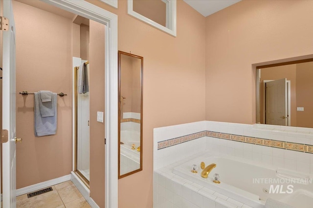 bathroom with baseboards, visible vents, tile patterned floors, a shower stall, and a bath