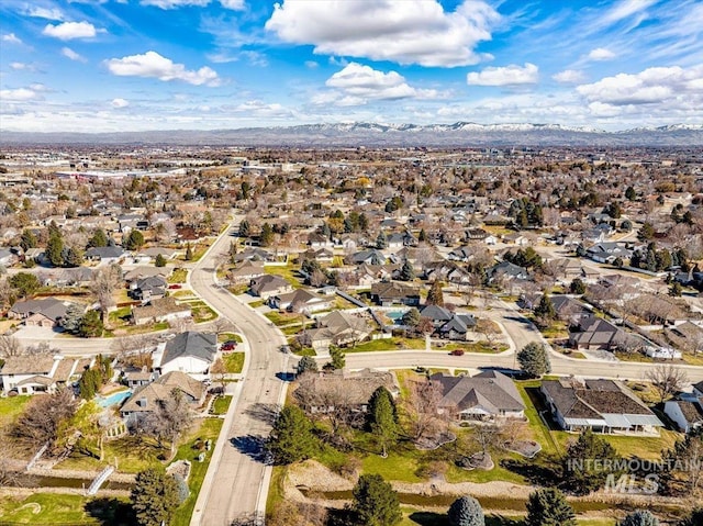 birds eye view of property with a mountain view and a residential view