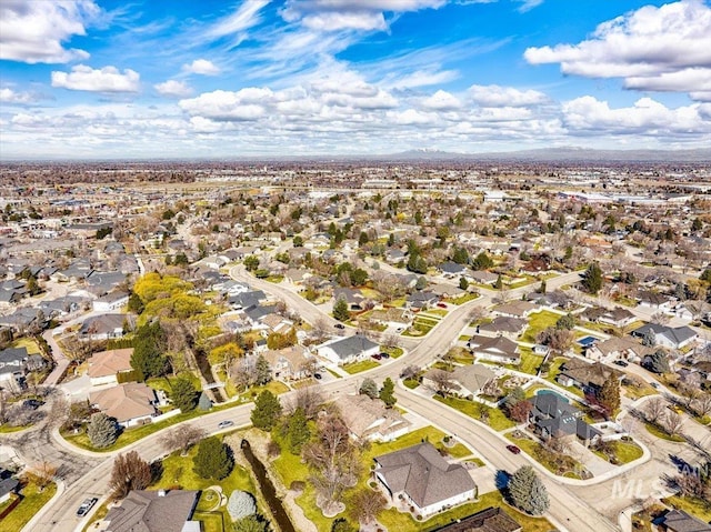 birds eye view of property with a residential view