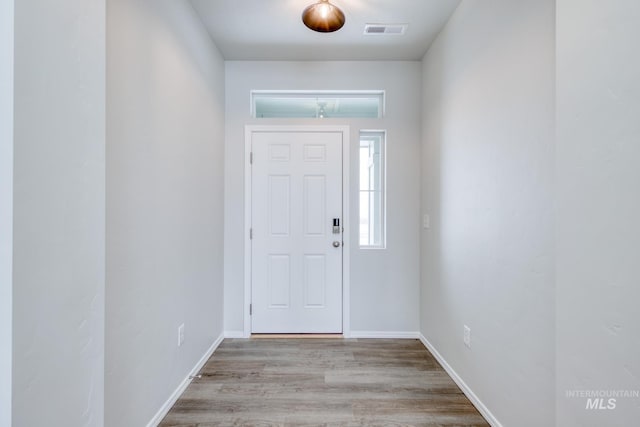 entryway with light hardwood / wood-style flooring