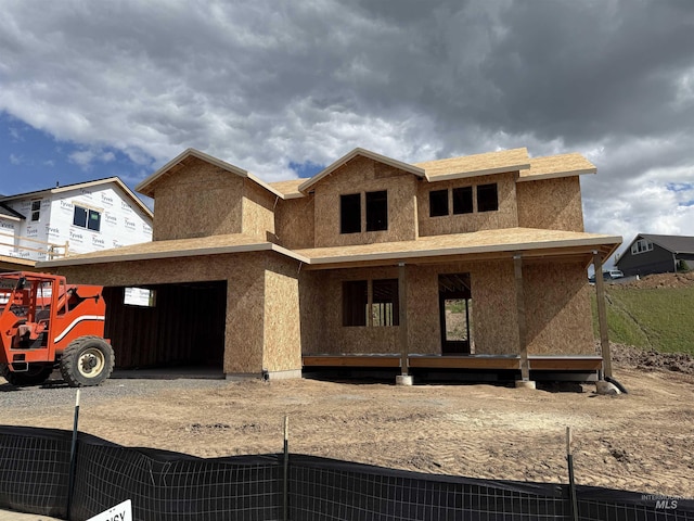 2463 E 3rd St, Moscow, ID 83843 - unfinished property featuring stucco siding, a garage, and driveway