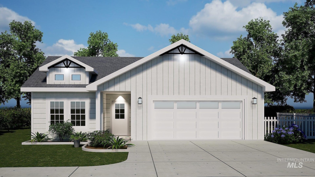 modern farmhouse with driveway, a shingled roof, an attached garage, fence, and a front yard