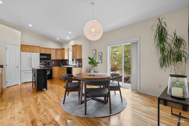 5873 N Collister Dr, Boise, ID 83703 - dining area featuring light wood-style flooring, lofted ceiling, and recessed lighting