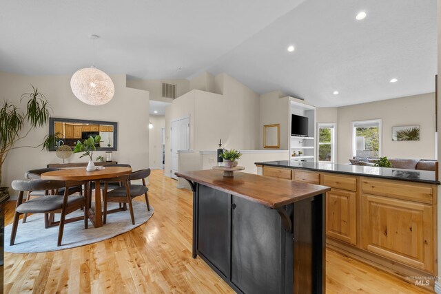 5873 N Collister Dr, Boise, ID 83703 - kitchen with wood counters, lofted ceiling, light wood-style floors, a kitchen island, and recessed lighting