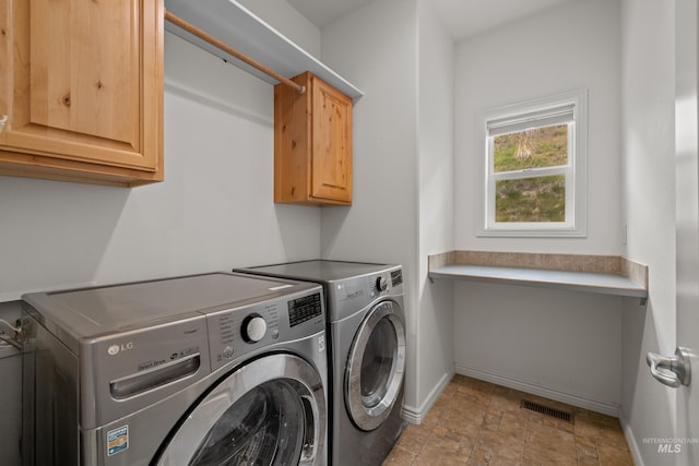 5873 N Collister Dr, Boise, ID 83703 - washroom with cabinet space, washer and dryer, baseboards, and light stone finish flooring