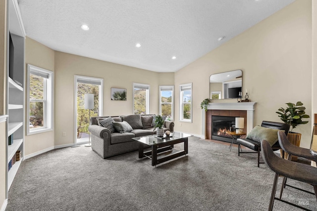 5873 N Collister Dr, Boise, ID 83703 - living area featuring carpet flooring, a tile fireplace, a textured ceiling, recessed lighting, and healthy amount of natural light