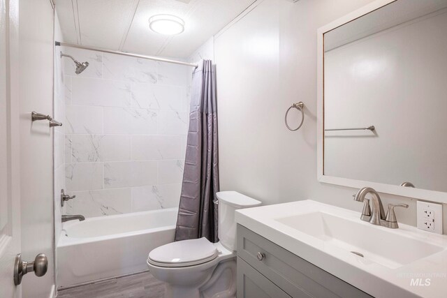 347 Winona Dr, Fairfield, ID 83327 - full bathroom with toilet, vanity, wood finished floors, and shower / bath combination with curtain