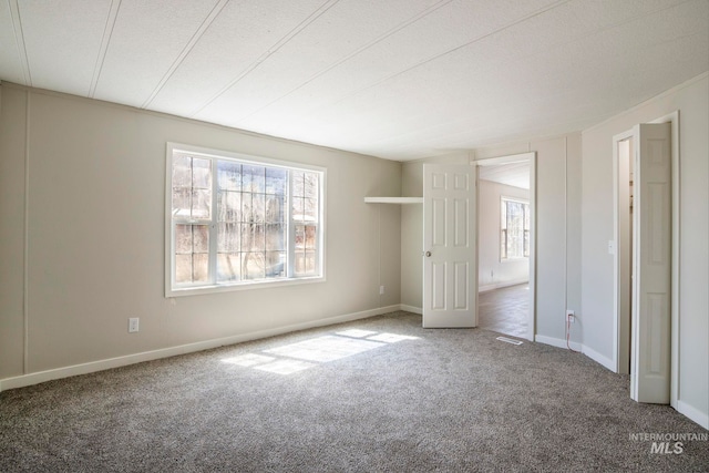 347 Winona Dr, Fairfield, ID 83327 - unfurnished bedroom featuring carpet flooring, visible vents, and baseboards