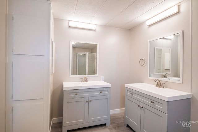 347 Winona Dr, Fairfield, ID 83327 - full bathroom featuring a sink, two vanities, and a shower stall