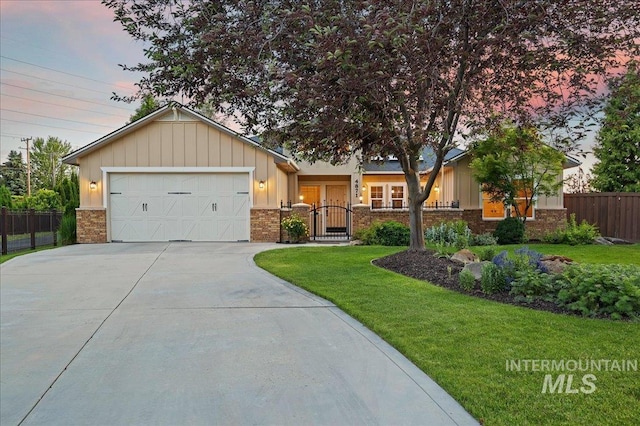 4871 N Red Hills Ave, Meridian, ID 83646 - ranch-style house with driveway, brick siding, an attached garage, and board and batten siding