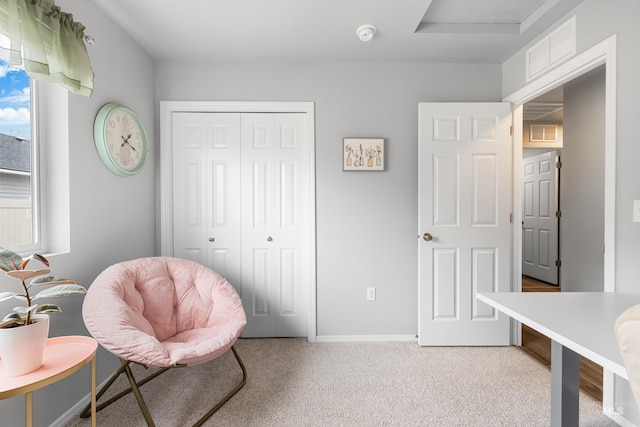 sitting room featuring visible vents, baseboards, and light colored carpet