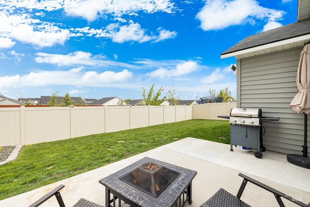 view of patio with a fenced backyard, grilling area, and an outdoor fire pit
