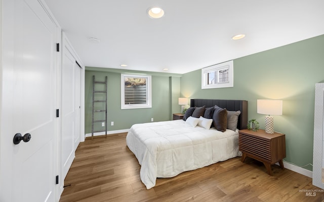 bedroom featuring recessed lighting, baseboards, and wood finished floors