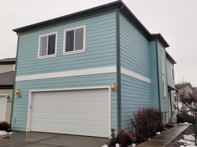 view of side of property with an attached garage