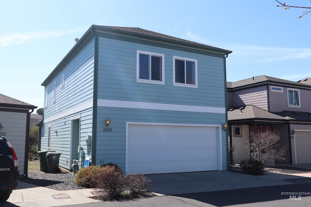 1209 Mainspring Ln, Moscow, ID 83843 - view of front of house with a garage and driveway