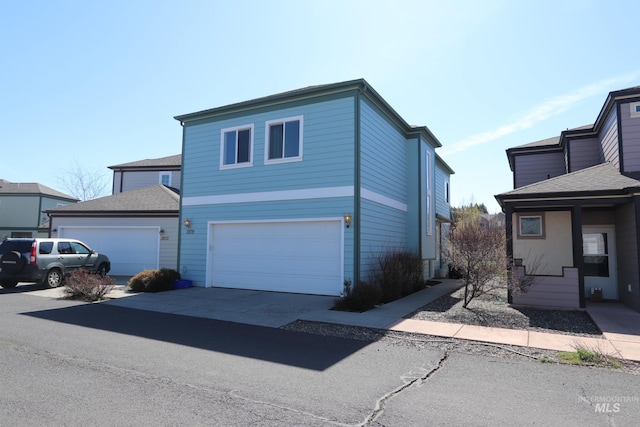 1209 Mainspring Ln, Moscow, ID 83843 - view of front of house featuring a garage and concrete driveway