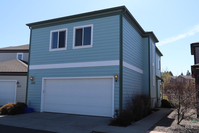 1209 Mainspring Ln, Moscow, ID 83843 - view of front of house featuring an attached garage and concrete driveway