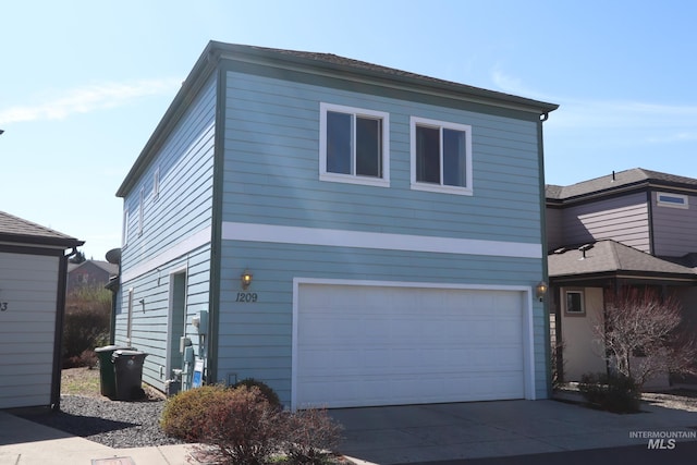 1209 Mainspring Ln, Moscow, ID 83843 - view of front facade featuring an attached garage and driveway