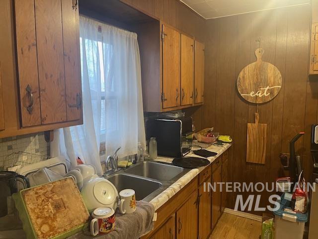 kitchen featuring sink and light wood-type flooring