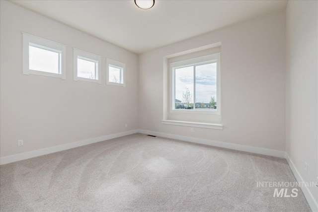 6201 W Redland Dr, Eagle, ID 83616 - spare room featuring baseboards, light carpet, and visible vents