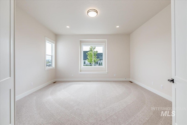 6201 W Redland Dr, Eagle, ID 83616 - unfurnished room featuring baseboards, plenty of natural light, and light carpet
